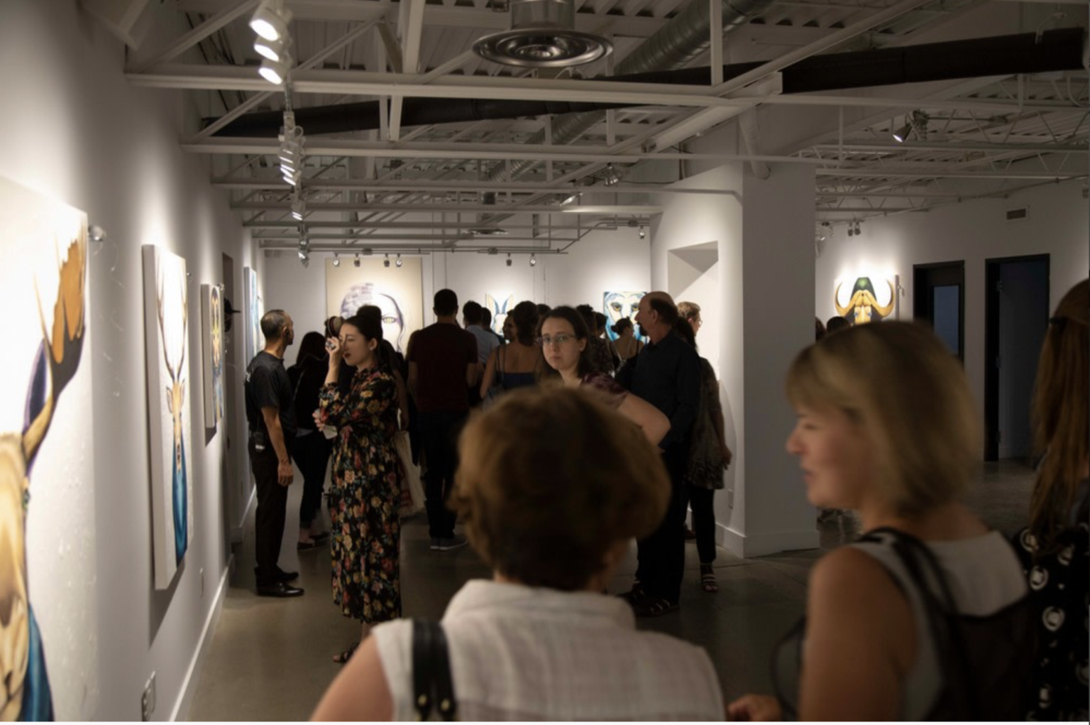 Visitors at the opening of the Canadian Animalize exhibition
